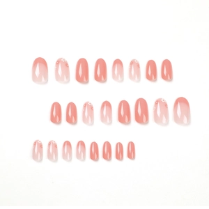 Pink gradient press-on nails set featuring delicate white flower art and glossy finish