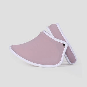 Side view detail of a pink sun visor hat with silver buckle and white trim for women