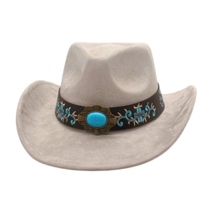 Detail of western cowboy hat with ethnic floral embroidery and turquoise stone buckle