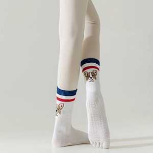 Detail of five-toe yoga socks with anti-slip silicone dots and cute corgi embroidery