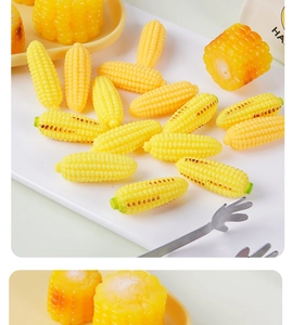 Macro shot of realistic miniature corn model with detailed kernels and roasted texture