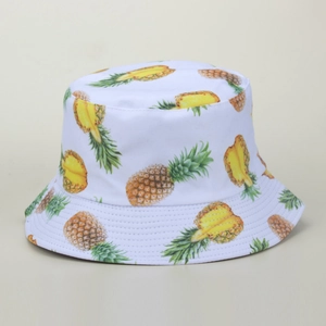 White bucket hat with all-over yellow pineapple pattern for sun protection outdoors