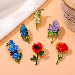 Floral enamel brooch set featuring lily of the valley and hyacinth in vibrant alloy colors