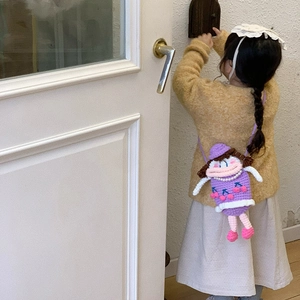 Handmade crochet cartoon doll shoulder bag for kids with pink lips and purple dress