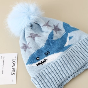 Winter knit hat for boys featuring shark jacquard, pom-pom, and ear flaps in light blue