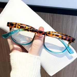 Blue-light blocking reading glasses with tortoiseshell and teal gradient frames