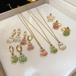 Elegant gold plated gourd jewelry set with cat eye stones and zircon accents