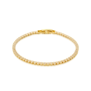 Detailed close-up of a gold-plated tennis bracelet with shimmering clear cubic zirconia