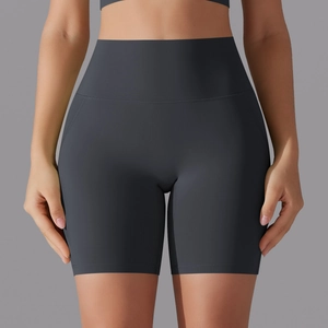 Close-up of high-waisted dark grey seamless yoga shorts with abdominal control detail