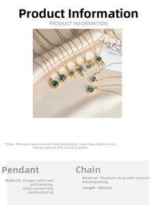 Detailed close-up of celestial planet necklace in gold-plated steel on silk background