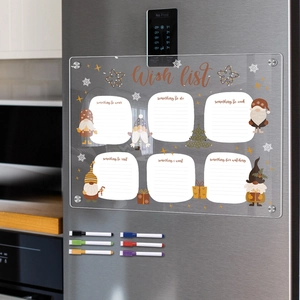 Detail of magnetic acrylic Christmas wish list board with colorful markers on a fridge