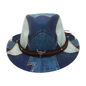 Detail of cowboy hat featuring blue denim texture with leather band and bull skull pendant