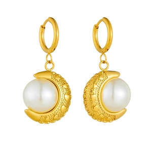 Elegant gold crescent moon pearl earrings with heart patterns on a white background
