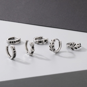 Crossed leaf and geometric titanium steel hoop earrings with black zircon stones