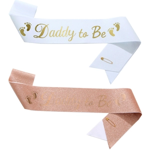 Glitter fabric Daddy to Be sashes in white and rose gold with gold pins for party