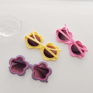 Set of three colorful sunflower shaped sunglasses for girls in yellow pink and purple