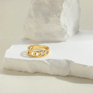 French vintage heart chain ring in gold finish on white stone minimalist aesthetic