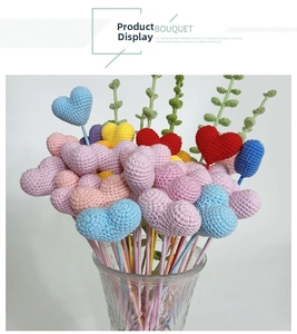Detailed view of colorful handmade crochet heart bouquet in a glass vase gift decor