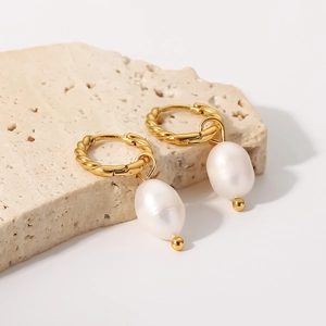 French twisted gold hoop earrings with natural freshwater baroque pearls on stone