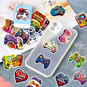 Close-up of waterproof gaming stickers on a phone case and varied retro controller designs