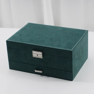 Three-layer vintage velvet jewelry organizer box in dark green with silver lock
