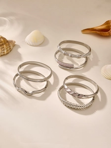 Detailed view of bamboo-textured silver bangles with pink and white zircon stones
