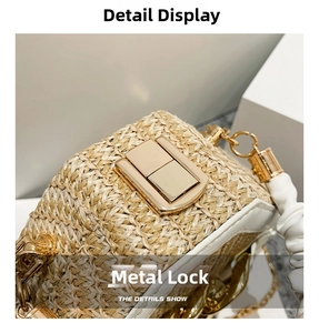 Detail of light yellow woven straw bag featuring gold hardware clasp and white leather trim