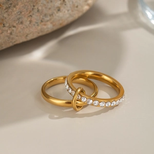 Interlocking double layer 18K gold ring with geometric design and pavé cubic zirconia