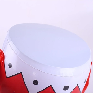 Detailed macro view showing the heat-sealed PVC seam and red zigzag pattern on an inflatable drum