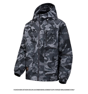 Detail of gray camouflage outdoor jacket featuring zip chest pocket and large flap pockets