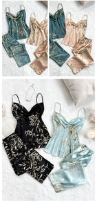 Flat lay of floral satin pajama sets featuring V-neck camisoles and matching pants