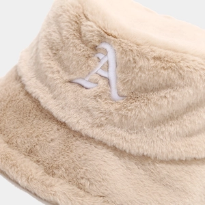 Detail view showing the soft texture and white embroidered letter A on a plush bucket hat