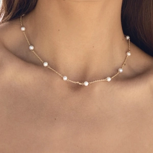 18K gold plated stainless steel necklace with natural freshwater pearls on model neck