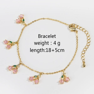Detail of gold cherry charm bracelet with pink crystals, length 18+5cm and 4g weight