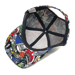 Detail view of baseball cap interior with sneaker prints and polyester care label