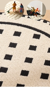 Detail of cream round rug showing woven texture and black square patterns for living room