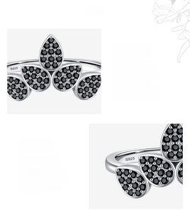 Macro shot of S925 hallmark on silver ring featuring hand-set black cubic zirconia stones