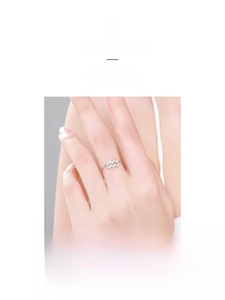 Detail of 925 sterling silver adjustable ring featuring a pavé set wavy Aquarius symbol