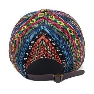 Detail of ethnic woven baseball cap with colorful patterns and leather adjustable back strap