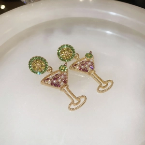 Detailed close-up of cocktail glass earrings with green rhinestones and pink pearls