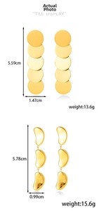 Detailed view of long gold tassel earrings with product dimensions and weight specs