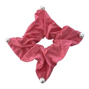 Pink fabric scrunchie in square star shape with white imitation pearls and soft pleats