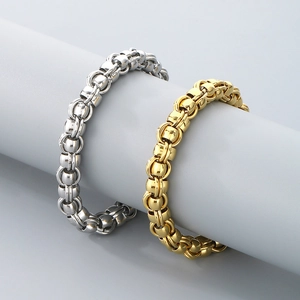 Detail view of chunky Byzantine style bracelets in polished gold and silver finishes