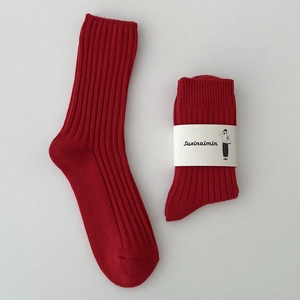 Festive red cotton crew socks for women featuring minimalist ribbed knit texture and cuff
