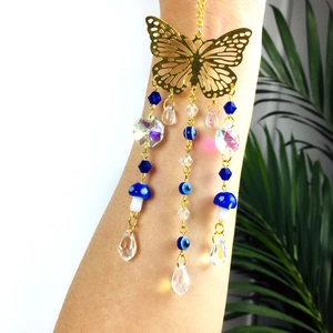 Golden butterfly car hanging charm with blue evil eye beads and crystal teardrop pendants