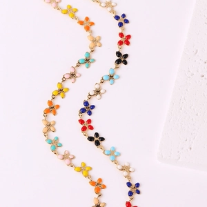 Fashionable clover metal necklace with colorful drip oil enamel on a clean white background