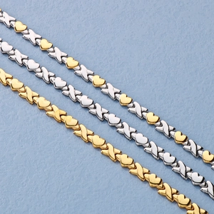 Three heart-shaped titanium steel bracelets in gold, silver and mixed gold finishes