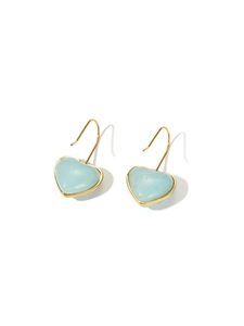 Close-up of light blue heart-shaped earrings with gold metal frame and hook