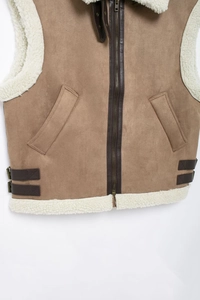 Detail of fleece collar and suede vest with adjustable leather straps and metal zipper