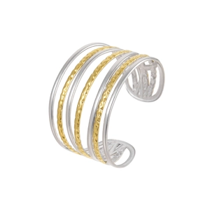 Detailed view of multilayer open cuff bracelet featuring gold hammered texture and silver finish